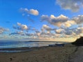 A beautifull clouds during a bright evening. A beach situation waiting for an evening