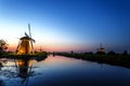 Beautifull dutch widmill at sunset and blue hour moment Royalty Free Stock Photo