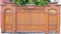 Beautifull gate and door, wicket and fence. Tall painted barrier. Russian style. Wooden architecture. Hand made carving Royalty Free Stock Photo