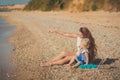 Beautifull mother lady with cute daughter girl on a beach sea side stylush dressed