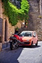 The beautifull street with the red car and the bike on the Rhodes island.