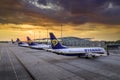 Beautifull sunset and low cost airline Ryanair airplane tails in front of Wroclaw Airport terminal Royalty Free Stock Photo