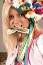 Beautifull ukrainian girl with dollar in her teeth