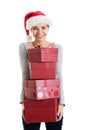 Beautifull woman in santa hat holding presents. Royalty Free Stock Photo