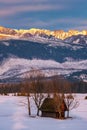 Beautifull wooden hut under amazing Krivan peak in High Tatras from frosty meadows with beautiful frozen trees. Royalty Free Stock Photo