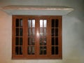 Beautifull wooden window with shelter