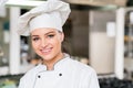 A beautifull young female chef posing for camera Royalty Free Stock Photo