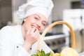 A beautifull young female chef posing for camera Royalty Free Stock Photo