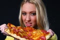 Beautifull young woman eating pizza Royalty Free Stock Photo