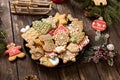 Beautifully arranged cookies in winter holidays theme, merry Christmas and happy New Year, rustic wooden background, biscuits with Royalty Free Stock Photo