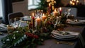Elegant Christmas Dinner Table Setting with Lit Candles, Festive Greenery, and Gold Accents for Holiday Celebrations and Winter Fe Royalty Free Stock Photo
