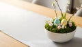 A beautiful Easter decoration with eggs and flowers in a white bowl Royalty Free Stock Photo