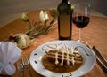 Beautifully arranged plate for dinner with red wine Royalty Free Stock Photo