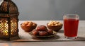 Ramadan Feast Dates Nuts and Refreshing Drink with Lantern Ambiance Royalty Free Stock Photo