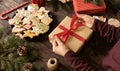 Beautifully arranged table in Christmas and New Year motives, traditionally shaped cookies and biscuits glazed in sugar icing with