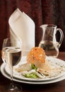 Beautifully arranged table with a plate of cheese and a glass