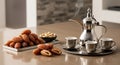 Traditional tea time setup with dates and snacks on a modern table Royalty Free Stock Photo