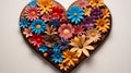 A beautifully carved wooden heart with vibrant, fresh flowers gracefully arranged around it