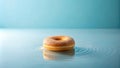 A single sugared doughnut floats serenely on a tranquil blue surface, creating a mesmerizing ripple effect. Generative AI Royalty Free Stock Photo
