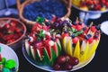 Beautifully decorated catering banquet table with different food snacks and appetizers on corporate christmas birthday party event Royalty Free Stock Photo