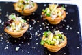 Beautifully decorated catering banquet table with different food snacks and appetizers with sandwich, caviar, fresh fruits on corp Royalty Free Stock Photo