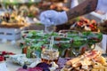 Beautifully decorated catering banquet table with different food snacks and appetizers with sandwich, caviar, fresh fruits on corp Royalty Free Stock Photo