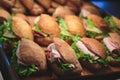 Beautifully decorated catering banquet table with different food snacks and appetizers with sandwich