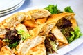 Beautifully decorated catering banquet table with different food snacks and appetizers with sandwich, pancakes, fresh salad on cor Royalty Free Stock Photo