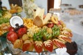 Beautifully decorated catering banquet table with different fresh fruits on corporate birthday party event or wedding celebration. Royalty Free Stock Photo