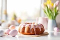 Beautifully decorated Easter bundt cake with white frosting and pastel colored sugar eggs. Glazed donut cake for Easter