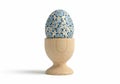 A beautifully decorated egg with intricate blue floral patterns is Royalty Free Stock Photo
