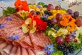 Beautifully decorated home made  salads with edible flowers  on table with different food snacks  party Royalty Free Stock Photo