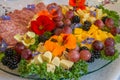 Beautifully decorated home made  salads with edible flowers  on table with different food snacks  party Royalty Free Stock Photo