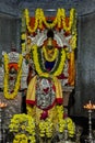 Beautifully decorated idol of Sri Lord Krishna Temple with flowers garlands and lights at Krishna Dhama, Mysuru.KARNATAKA, INDIA