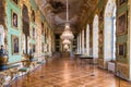 Beautifully decorated interior hallway with display of paintings