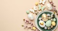 A beautifully decorated plate of Easter eggs and flowers on a pastel background Royalty Free Stock Photo