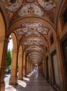 Beautifully decorated portici in Cavour square in Bologna, Italy