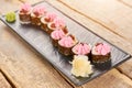 Beautifully decorated sushi rolls on plate. Royalty Free Stock Photo