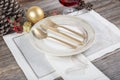 Beautifully decorated table with white plates, glasses, antique cutlery and luxury tablecloths white coral. Christmas table place