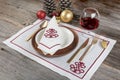 Beautifully decorated table with white plates, glasses, antique cutlery and luxury tablecloths white coral. Christmas table place