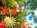 Beautifully decorated Christmas tree against bright and shiny soft focused background. Christmas and New Year concept.