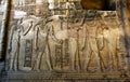 A beautifully decorated wall displaying engravings and hieroglyphs at the Temple of Kom Ombo in Egypt. Royalty Free Stock Photo