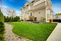 Beautifully designed backyard with green trim and stoned flower