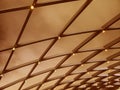 A beautifully designed ceiling with a geometric pattern and lights Royalty Free Stock Photo