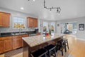 Beautifully designed kitchen with a marble and wood island in a suburban home Royalty Free Stock Photo