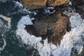 Beautifully detailed aerial drone landscape image of bird`s eye view of waves crashing over rocks at shore