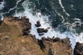 Beautifully detailed aerial drone landscape image of bird`s eye view of waves crashing over rocks at shore