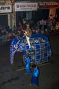 A beautifully dressed ceremonial elephant parades down Colombo Street in Kandy, Sri Lanka during the Esala Perahera.