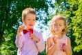 Beautifully dressed kids with soap bubbles