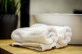 Beautifully folded white towels and toiletries. Modern hotel bathroom Royalty Free Stock Photo